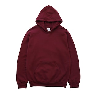 May include: A maroon hoodie with a hood and a front pocket. The sweatshirt is made of a soft material and is a solid color. The hoodie is a casual style and is suitable for everyday wear.