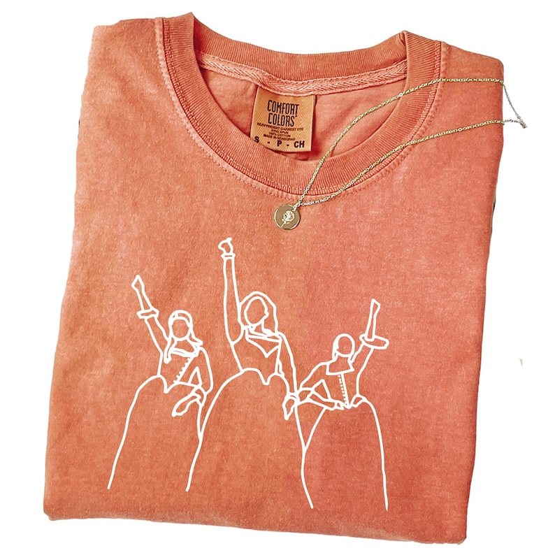 a t - shirt with a picture of a group of people on it