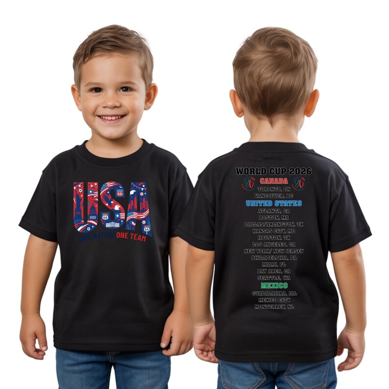 A young boy wearing a black t-shirt with text and graphics printed on it.