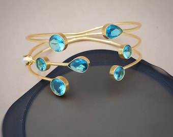 Elegant 18K Gold Plated Cuff Bracelet with Teardrop Topaz Blue Crystals, Adjustable and Modern Design Perfect for Everyday Wear