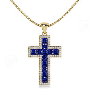 May include: A gold cross pendant necklace with a blue sapphire center and a diamond halo. The cross is set with smaller blue sapphires around the edges.