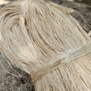 May include: A set of three ceramic mugs with a speckled, matte finish. Each mug is a different colour: light blue, cream, and grey. The mugs have a simple, modern design and a comfortable handle.