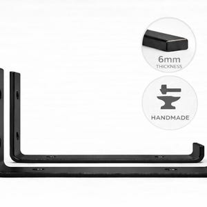 May include: Two black, L-shaped metal shelf brackets. The brackets are handmade and have a 6mm thickness. The brackets are designed to be mounted on a wall to support shelves. The brackets are shown on a white background.