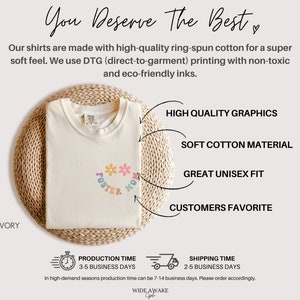May include: Ivory t-shirt with a colorful graphic that says "Foster Mom" with flowers. The shirt is made with high-quality ring-spun cotton and is a great unisex fit.
