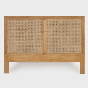 May include: A rectangular headboard crafted from light brown wood, featuring two symmetrical panels of woven cane webbing. The frame is constructed with vertical and horizontal wooden slats, providing a structured and natural appearance.