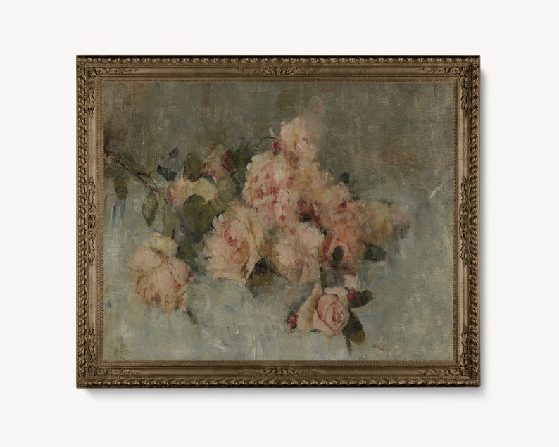 May include: A framed oil painting of a bouquet of pink roses on a light blue background. The roses are arranged in a loose, natural style, with some of the petals falling onto the surface below. The painting is framed in a simple, gold-colored frame.