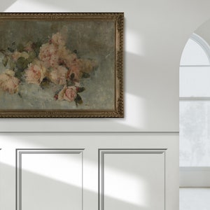 May include: A framed painting of a bouquet of pink roses with green leaves on a light blue background.
