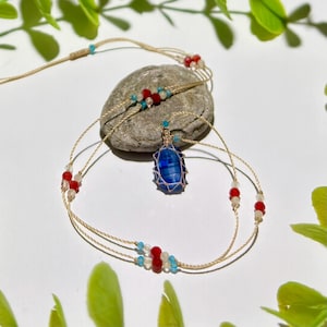 May include: A white ceramic mug with a black handle and the text "But First, Coffee" in a bold, black font. The mug is set against a neutral background, highlighting its simple design.