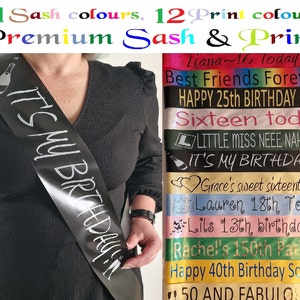 May include: A black satin sash with the text "IT'S MY BIRTHDAY!" printed in silver. The sash is being worn by a person. The image also shows a variety of other sashes with different birthday messages printed on them.
