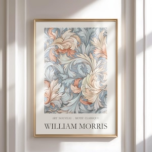 May include: A framed art print with a floral pattern in peach, cream, and blue hues. The print is labelled "ART NOUVEAU, MOTIF CLASSIQUE" and "WILLIAM MORRIS". The frame is gold.