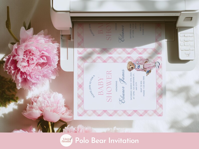 May include: A baby shower invitation featuring a pink plaid border and a watercolor illustration of a teddy bear wearing a pink outfit. The invitation includes the text "Baby Shower" and event details. Pink peonies are in the background.