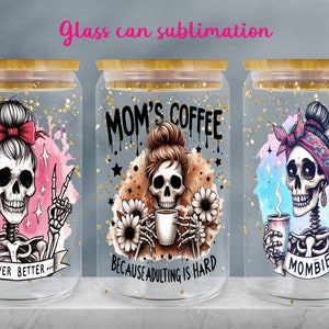May include: Three glass jars with lids and a gold glitter background. Each jar features a skull with a different design and text. The first jar says "...Never Better..." The second jar says "Mom's Coffee Because Adulting Is Hard." The third jar says "Mombie."