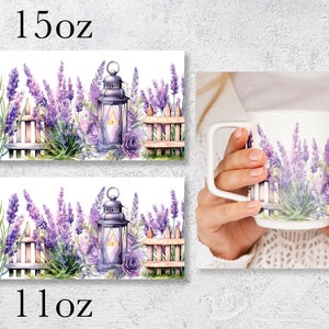 May include: Two white ceramic mugs with a lavender floral design. The design features a picket fence, a lantern, and lavender flowers. The mugs are available in 11 oz and 15 oz sizes.