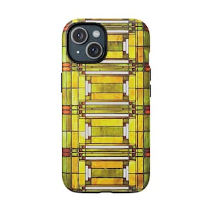 May include: A smartphone case featuring a geometric stained glass pattern in shades of yellow, olive green, and white, with thin dark brown lines separating the rectangular shapes and small orange accents along the side edges of the design.
