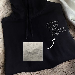 Black hoodie with writing on sleeves best sale