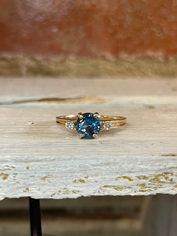 Three Stone Blue Topaz and Diamond Ring