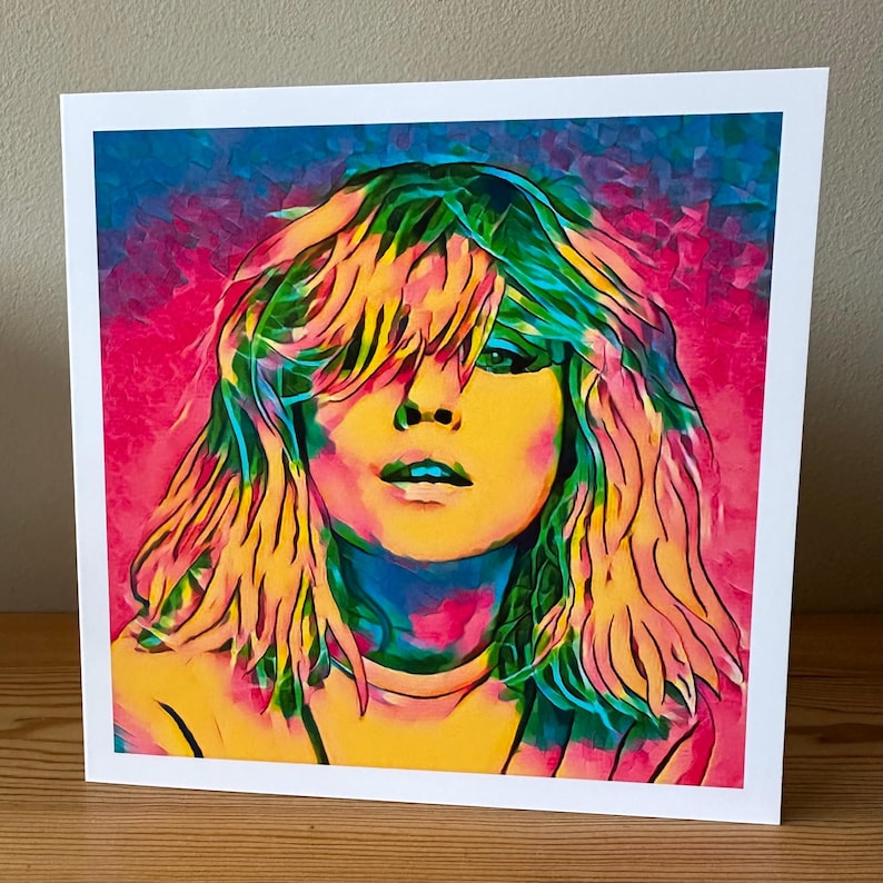 Pop art greeting card featuring Debbie Harry, the iconic lead singer of Blondie, illustrated in bold vibrant retro colors. This 80s music-inspired card captures her punk rock energy and new wave style, making it a perfect gift for Blondie fans, music lovers, and collectors of retro art. Ideal as a birthday card, fan memorabilia, or unique stationery, this Debbie Harry card adds a cool, edgy touch for anyone who loves rock and pop culture.