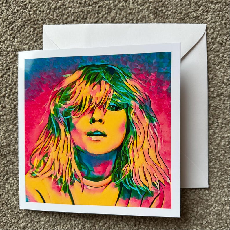 Pop art Debbie Harry card with a striking Blondie portrait in vibrant retro colors, perfect for fans of 80s music, punk rock, and new wave. This greeting card makes a unique birthday gift, collectible art piece, or stylish stationery for music lovers and pop culture enthusiasts. Bold, edgy, and colorful, it captures the essence of Debbie Harry’s iconic style while making your gift truly stand out for Blondie fans and beyond.