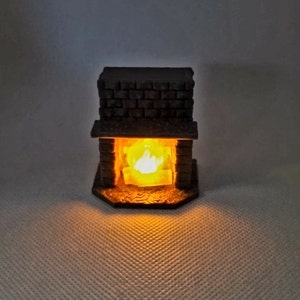 May include: A miniature brick fireplace with a glowing orange light inside, simulating a fire.