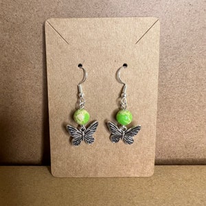 MKW Emporium Silver Handmade Beaded Charm Earrings Marbled Light Green & Yellow Bead with a Silver Butterfly Charm #101