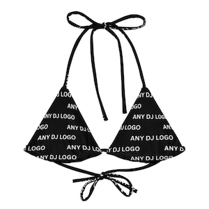 May include: Black bikini top with white text that reads "ANY DJ LOGO". The triangle-shaped top has tie closures at the neck and back. The text is repeated across the fabric.