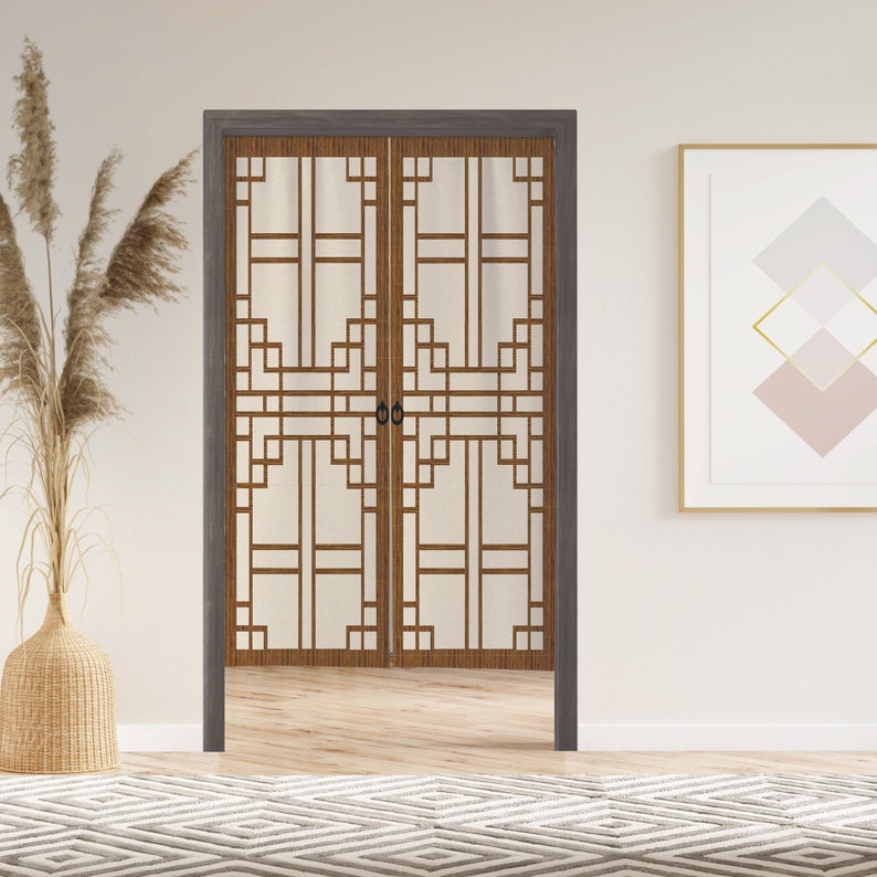 May include: A pair of brown wooden sliding doors with a geometric pattern of squares and rectangles. The doors have a white background and are set against a white wall.
