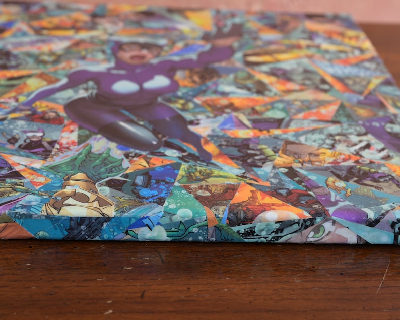May include: A close-up of a canvas painting with a collage of colorful comic book pages. The painting features a woman in a purple costume, with a blue and green background.