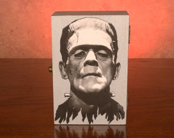 Frankenstein jewelry or keepsake box made by repurposing a small photo of the monster it is a 6 in by 4 in box