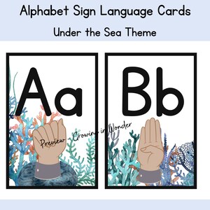 May include: Two alphabet sign language cards with an under the sea theme. The first card shows the letter A in black with a hand signing the letter A. The second card shows the letter B in black with a hand signing the letter B. Both cards have a watercolor background of coral and seaweed.