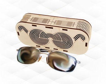 May include: A wooden sunglasses case with a geometric design. The case is open and a pair of silver sunglasses are resting on top of it.