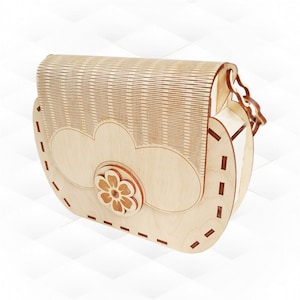 May include: A wooden purse with a flower design and a stitched detail. The purse has a strap and is made of light wood.