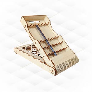 May include: A wooden desk organizer with a pencil in the center. The organizer is made of light-colored wood and has multiple slots for pens and pencils. The base of the organizer has a decorative cutout design.