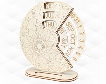 May include: A wooden perpetual calendar with a sunflower design. The calendar displays the date, month, and day. The current date is July 26, Thursday. The calendar is made of light-colored wood and has a decorative sunflower design.
