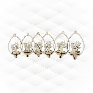 May include: Six wooden Easter egg ornaments. Each ornament features a laser-cut design of a bunny, flowers, and a small shelf. The ornaments are light brown and have a small hole at the top for hanging.