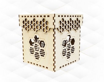 May include: A wooden box with a honeycomb design on the top and sides. The box has a cutout of a bee on each side.