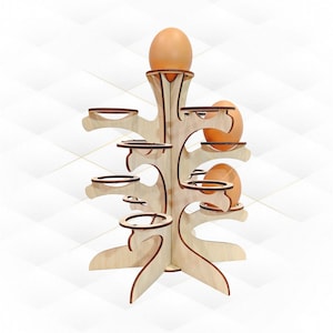 Puede incluir: Un soporte para huevos de madera con forma de árbol con múltiples ramas y una base. El soporte tiene seis hueveras y puede contener hasta siete huevos.