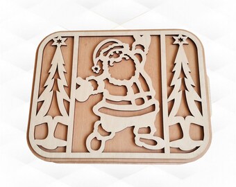 May include: Wooden cutout of Santa Claus with a beard, wearing a hat and holding a bag, standing between two Christmas trees.