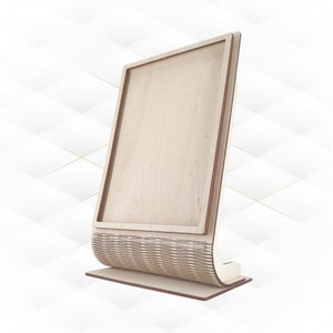 May include: A wooden display stand with a rectangular frame and a curved base. The stand is made of light brown wood and has a natural finish.