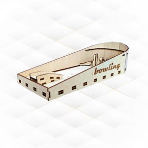 May include: Wooden bowling game with a ramp and pins. The game is made of light wood and has the word "bowling" printed on the side.