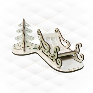 Kartka z życzeniami świątecznymi, układanka 3D, projekt cięcia laserowego. Projekt cięcia laserowego, karty podarunkowe na Boże Narodzenie, sanie choinkowe. Szablon wektorowy Svg dxf