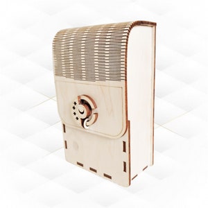 May include: A light wood box with a decorative latch. The box has a patterned design on the top and a smooth surface on the front.