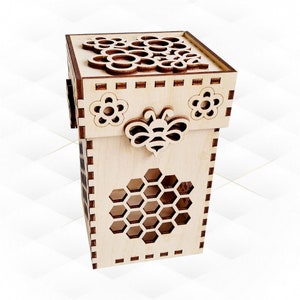 May include: A wooden box with a honeycomb design and a bee cutout. The top of the box has a floral design and a bee cutout.