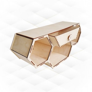 May include: A wooden hexagonal shelf unit with a small drawer. The shelf unit is made of light wood and has a natural finish. The drawer is also made of wood and has a small knob.