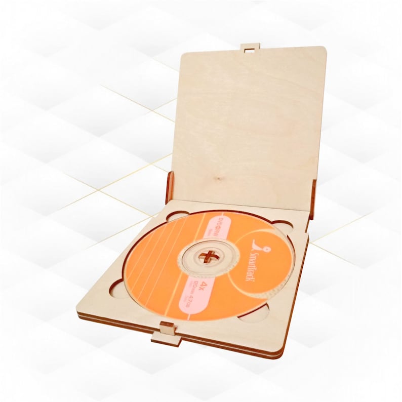 May include: A wooden CD case with a hinged lid, open to reveal an orange CD with the text "4K Ultra HD Blu-ray Disc" and the logo "smartflix".