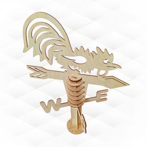May include: A wooden weathervane in the shape of a rooster. The design includes a rooster silhouette, directional arms, and a base. The rooster's tail and comb are intricately cut. The letters "W" and "E" are visible.