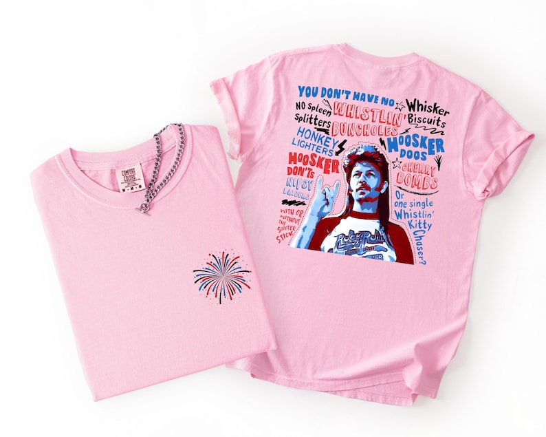 May include: Two pink t-shirts. One has a firework design on the front and a silver chain. The other has a graphic of a man with text that reads "YOU DON'T HAVE NO WHISTLIN' BISCUITS".