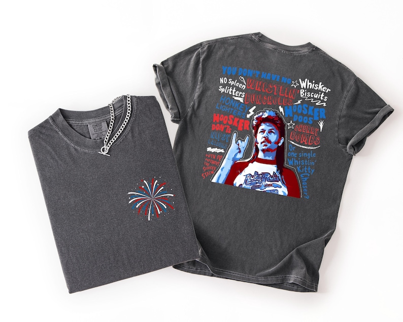 May include: Two charcoal gray t-shirts. One has a small embroidered firework design. The other features a graphic of a man with text that reads "YOU DON'T HAVE NO WHISTLIN' SPLITTERS, MOOSKER, DOOS, WHISKER BISCUITS, and MOOSKER DOOS." A silver chain necklace is on the first shirt.