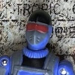 May include: A blue and black action figure with a red visor and a black helmet. The figure is wearing a blue and black uniform.