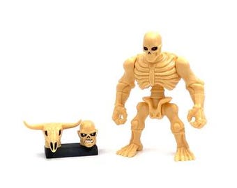 Glyos Mighty Maniax Dark Earth Bone Raider Action Figure