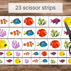 May include: A printable worksheet with 23 scissor strips featuring colorful fish, coral, and seaweed illustrations. The worksheet is titled "23 scissor strips".